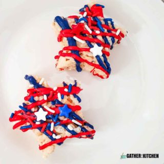 top down view of 2 Rice Krispy treat stars with red and white drizzled and red, white, and blue sprinkles.