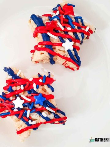 top down view of 2 Rice Krispy treat stars with red and white drizzled and red, white, and blue sprinkles.