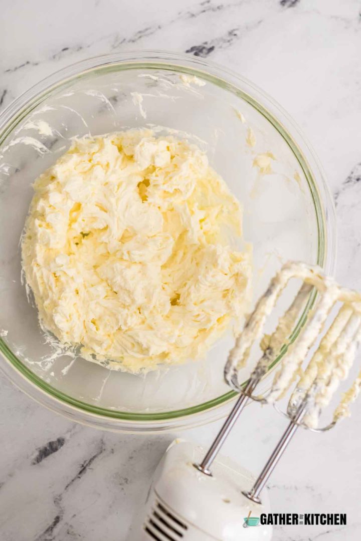Creamed butter and cream cheese in a bowl.