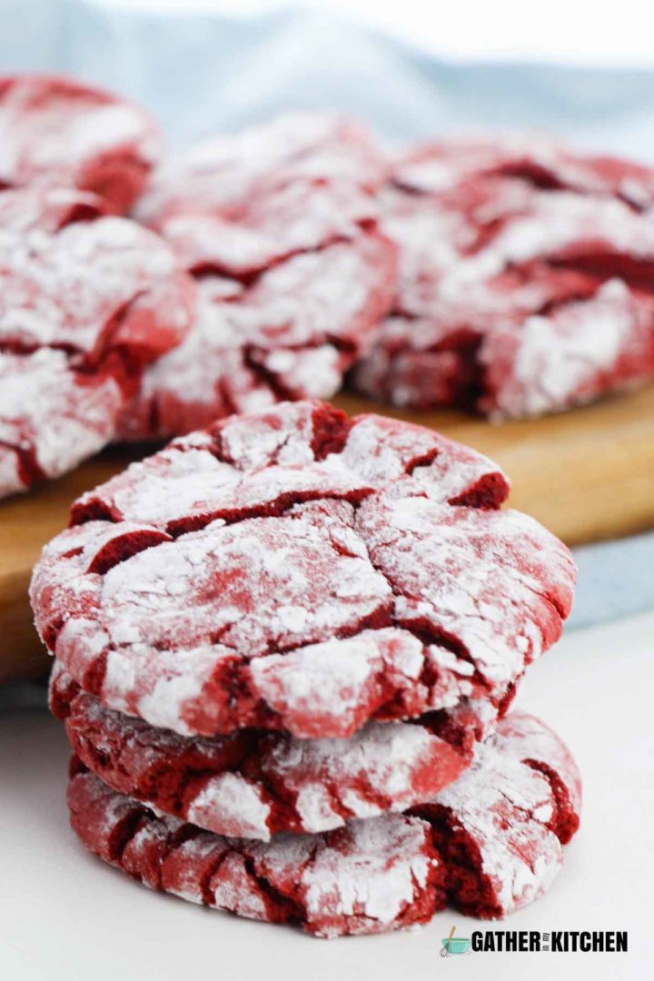 Stack of red velvet crinkle cookies.