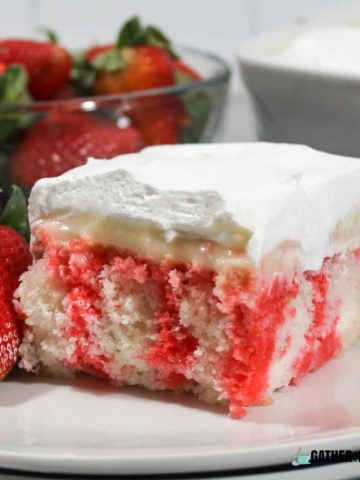 Strawberry Cheese Cake Poke Cake on a Plate.