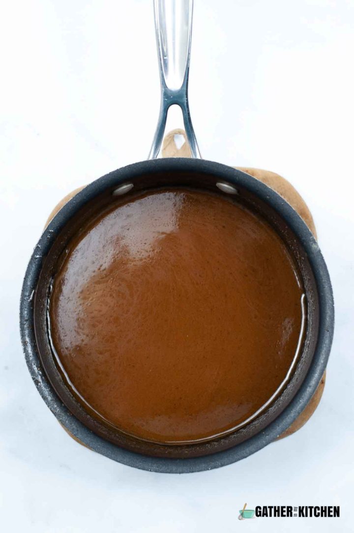 Pan full of caramel sauce.