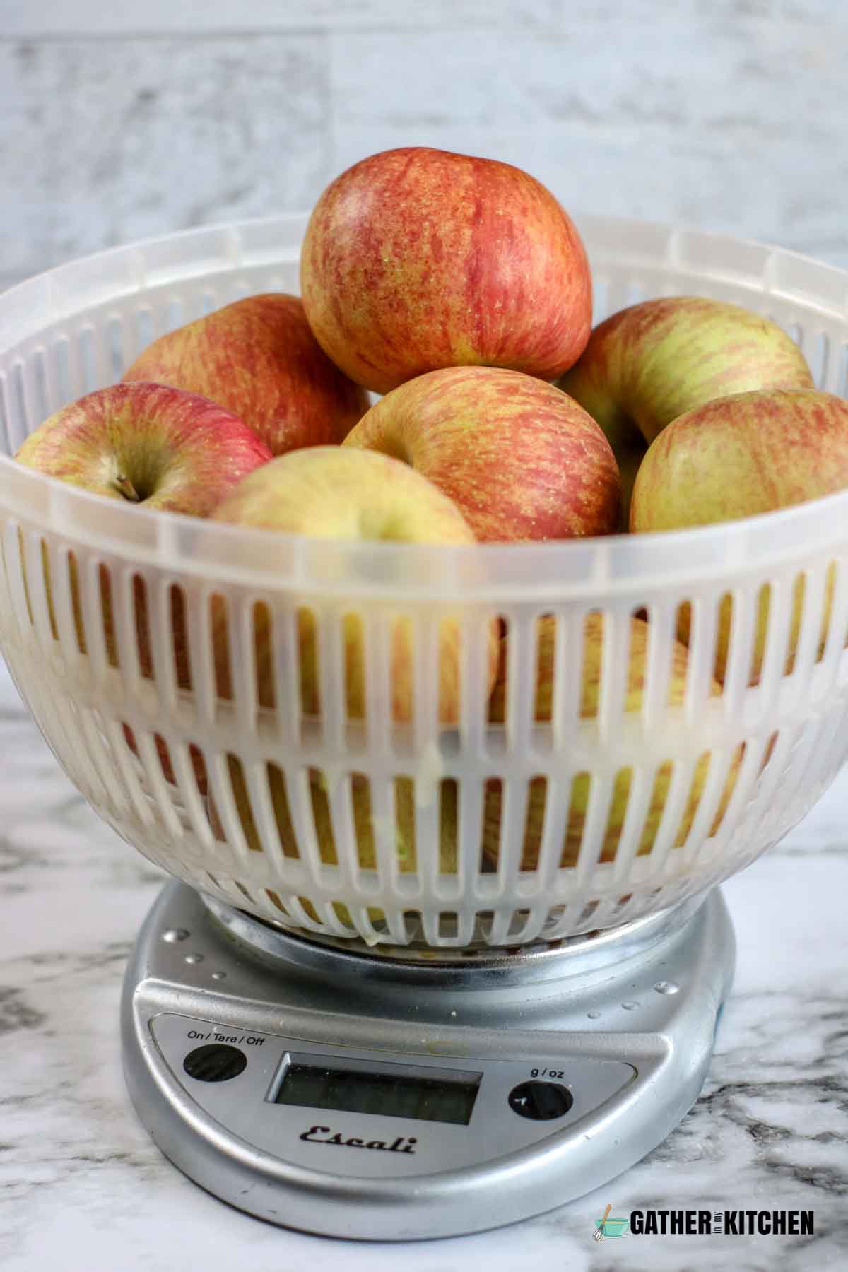 Basket of apples on scale.