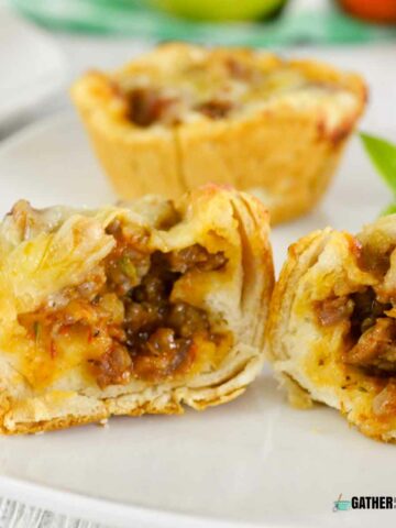 Italian sausage biscuit cups in half.