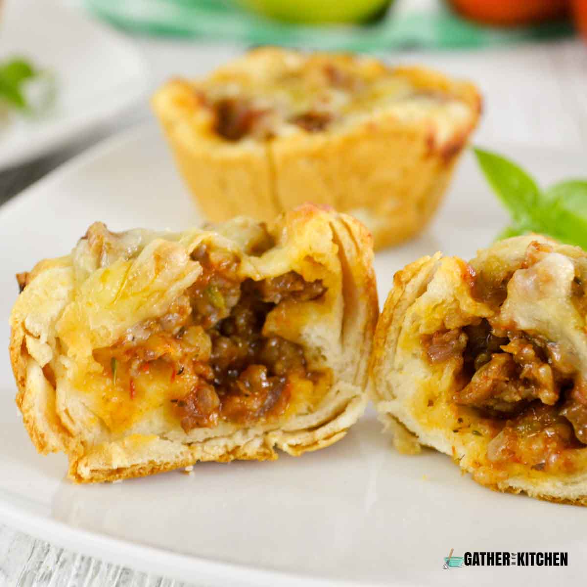 Italian sausage biscuit cups in half.