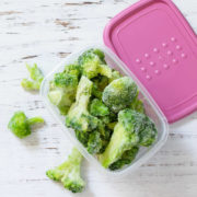 Broccoli in a plastic container.