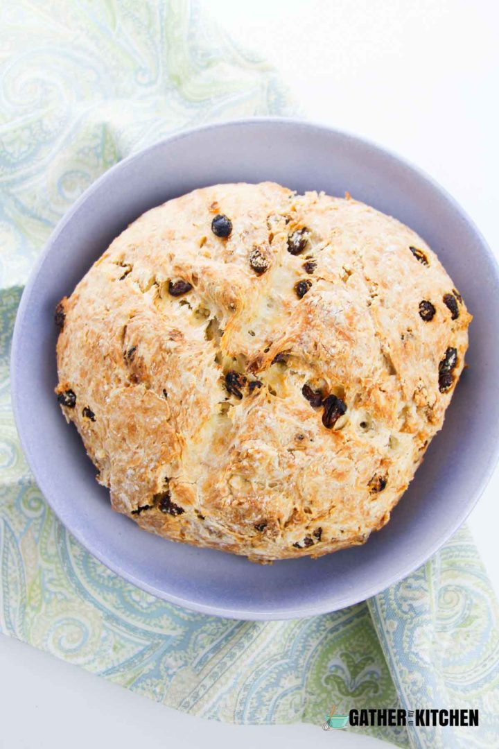 Top down view of baked soda bread in a round bowl.
