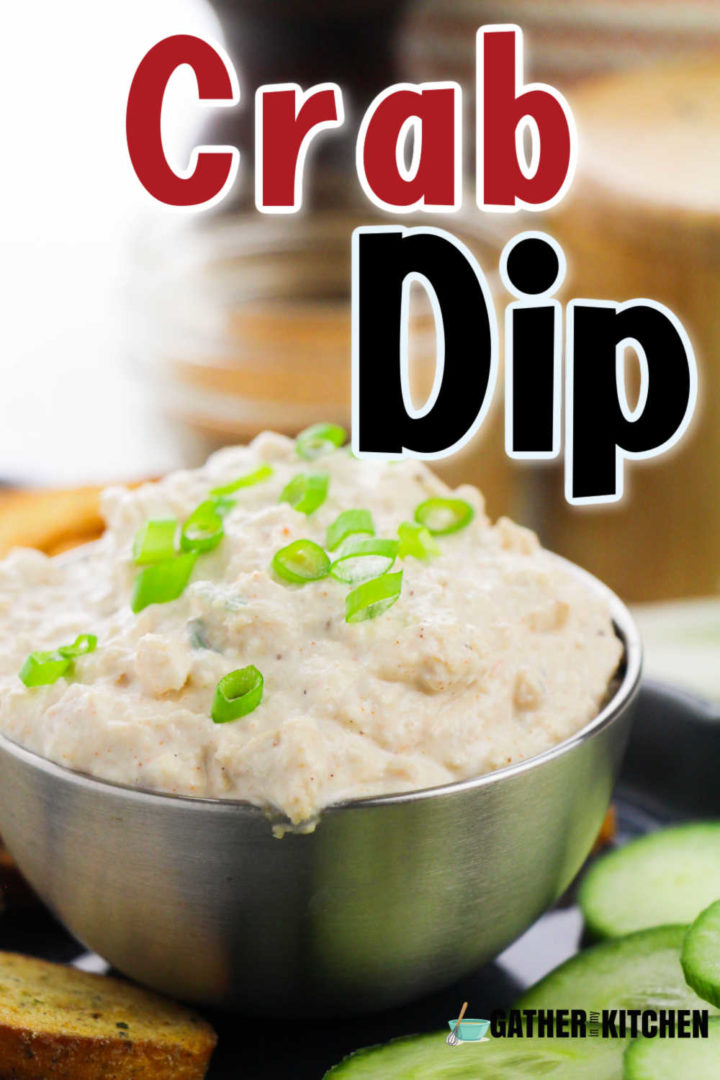 Pin image: words "Crab dip" on top of picture of crab dip in a metal bowl.