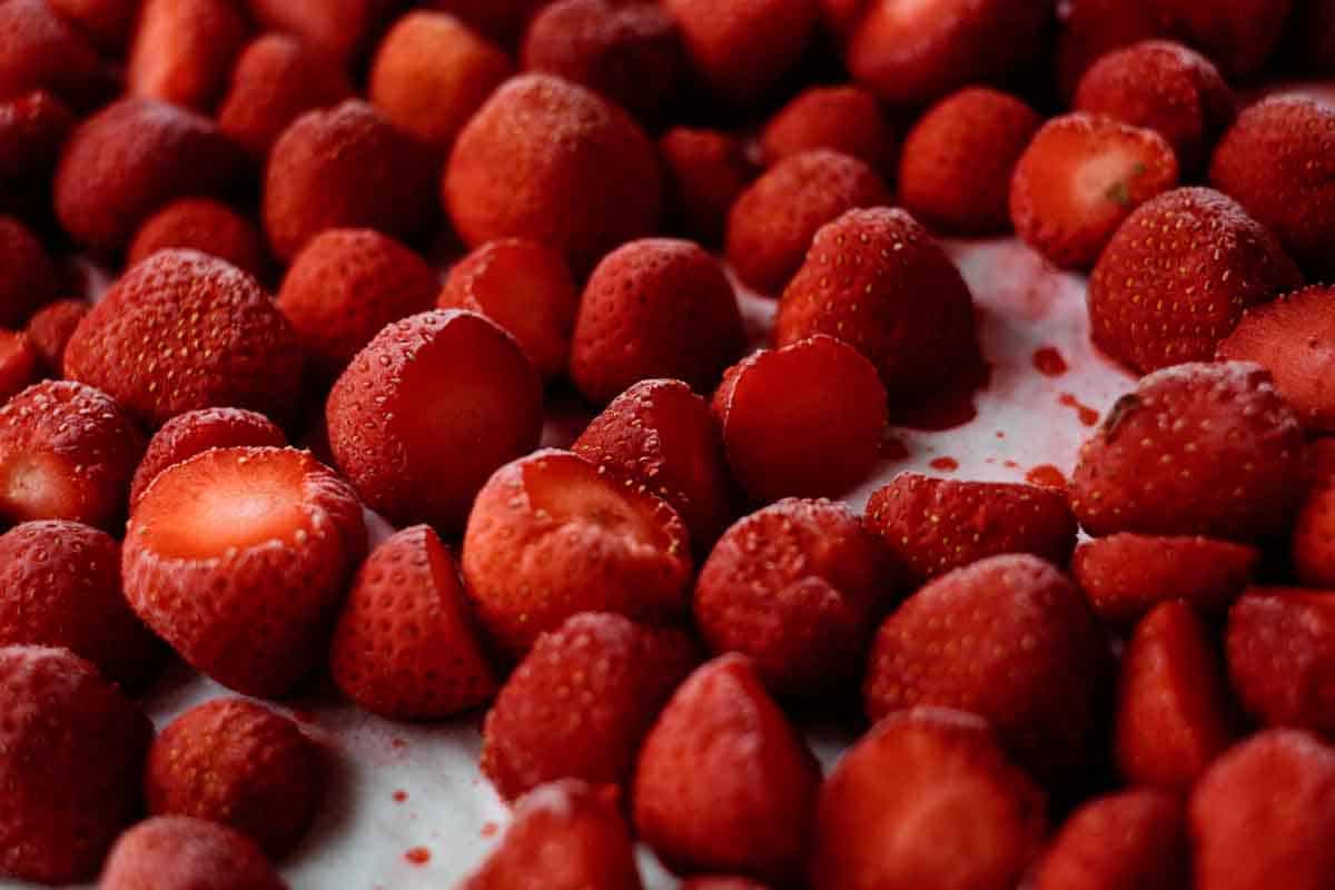 strawberries frozen on baking sheet.