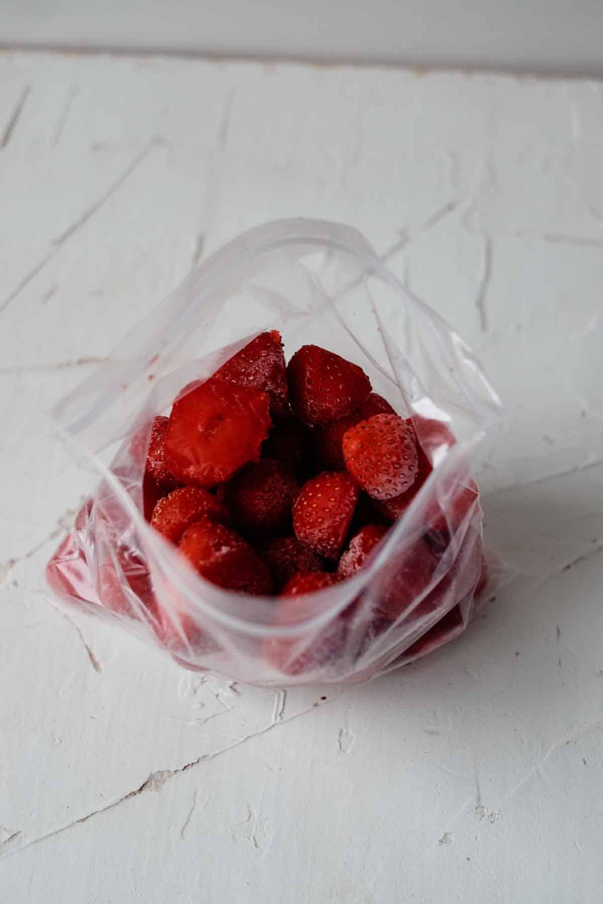 Frozen berries in plastic freezer bag.
