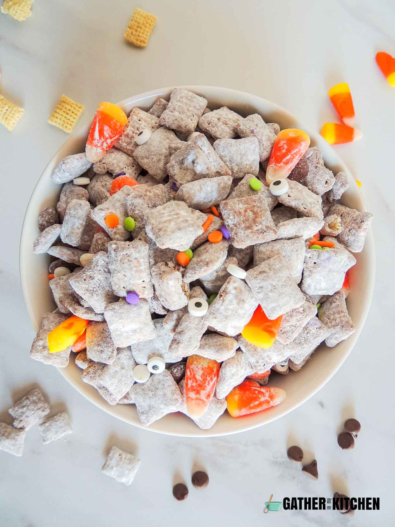 Top down view of Halloween Muddy buddies in a bowl.