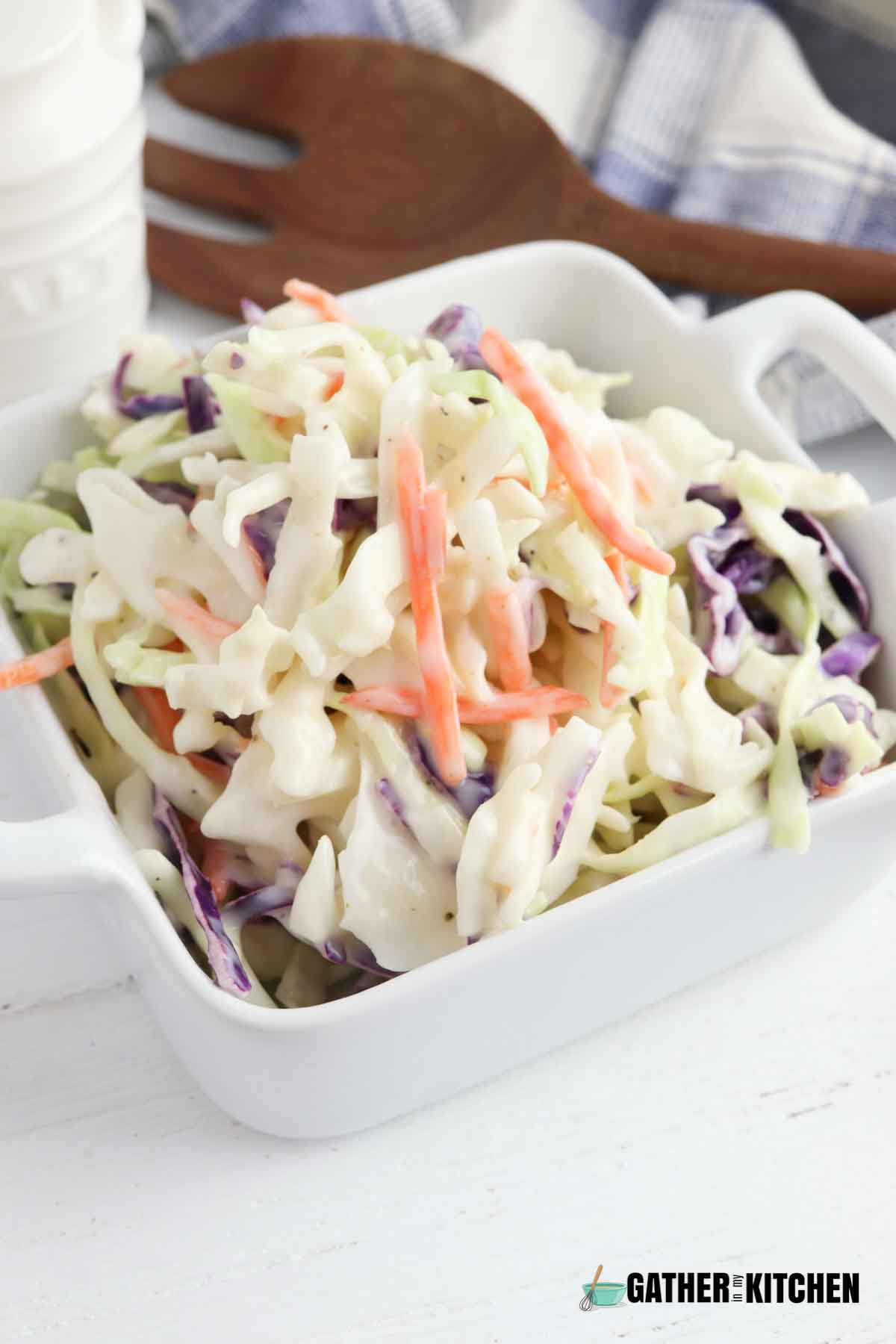 Coleslaw in a white square bowl.