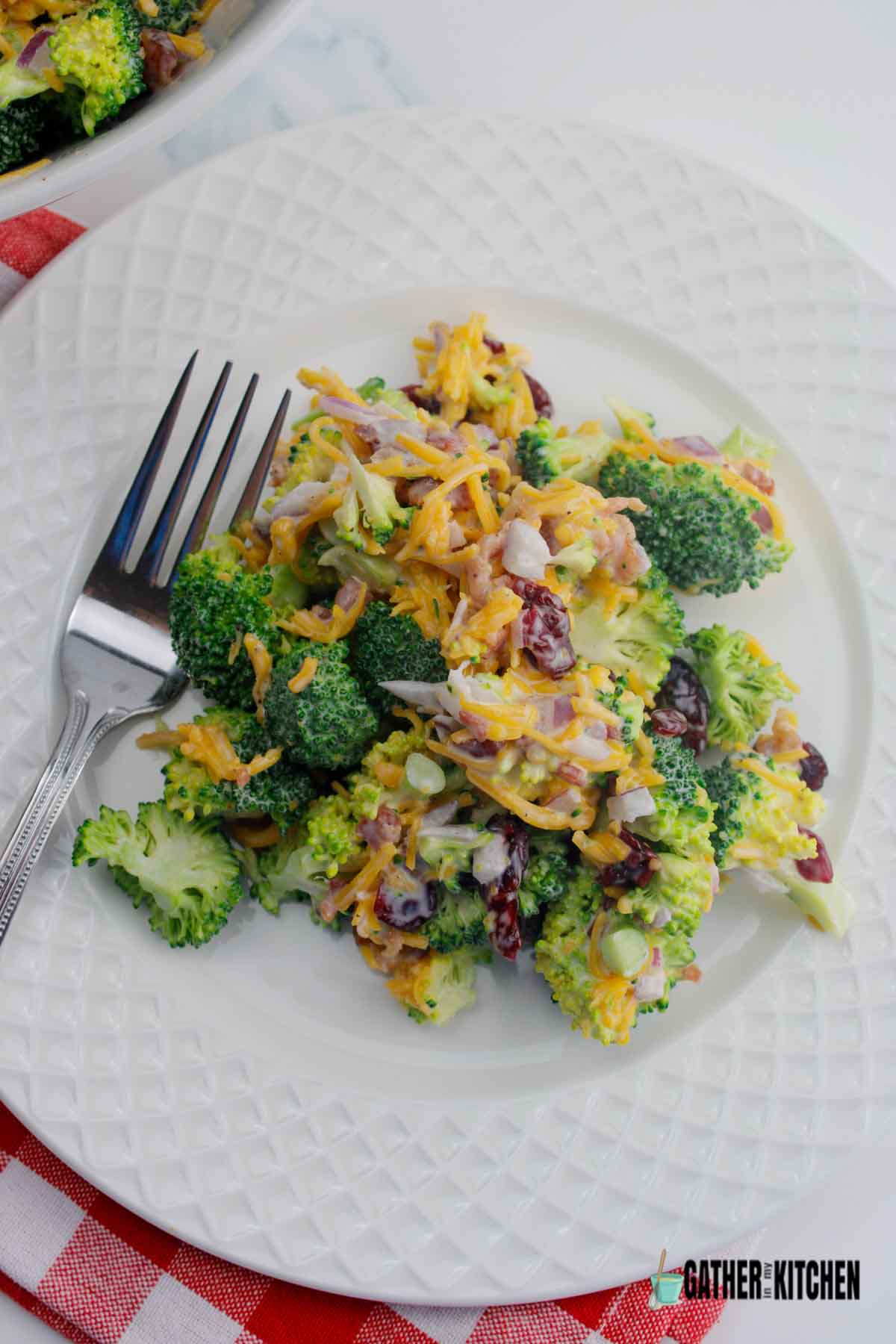 Top down view of broccoli salad on a plate.