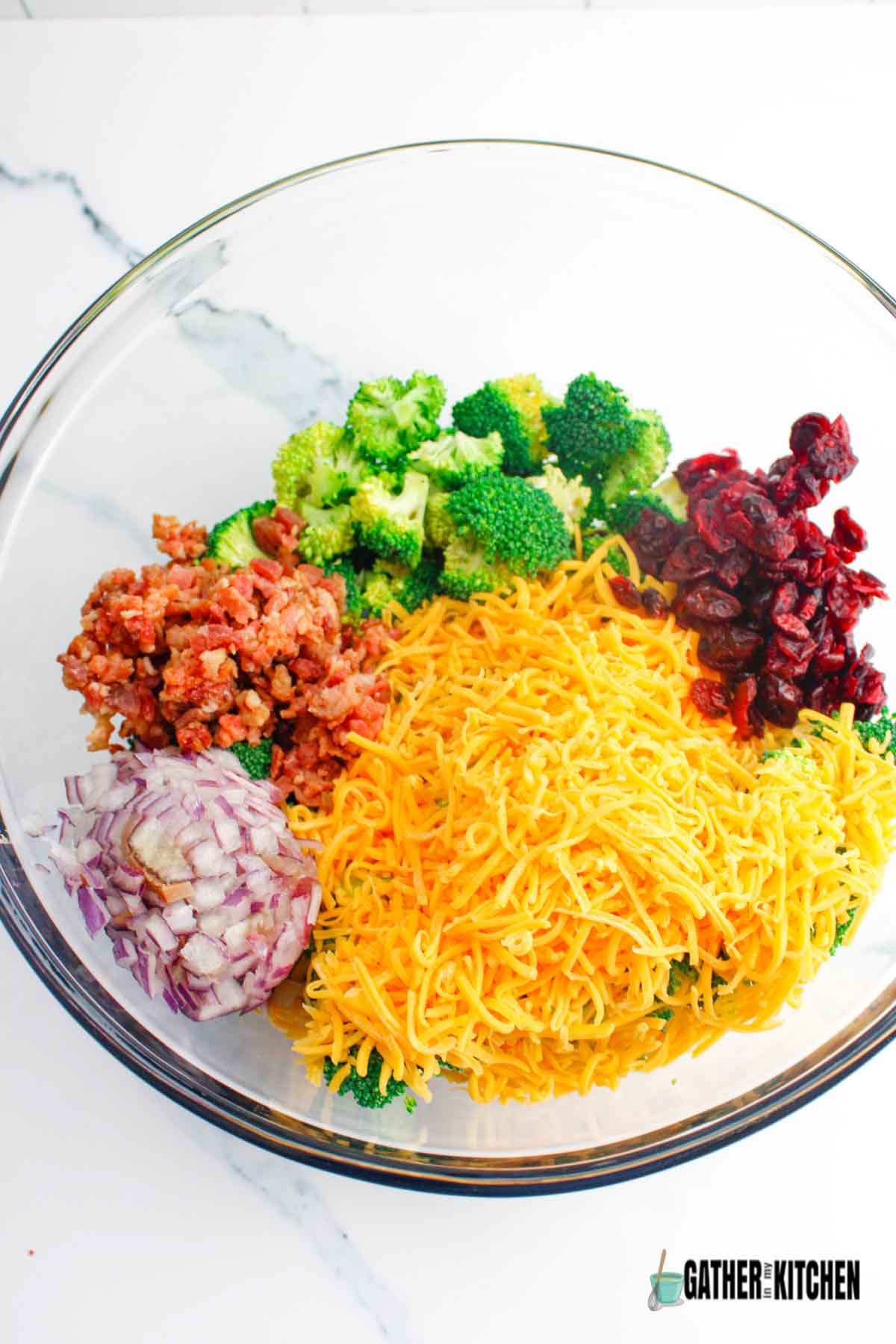broccoli salad ingredients in bowl.