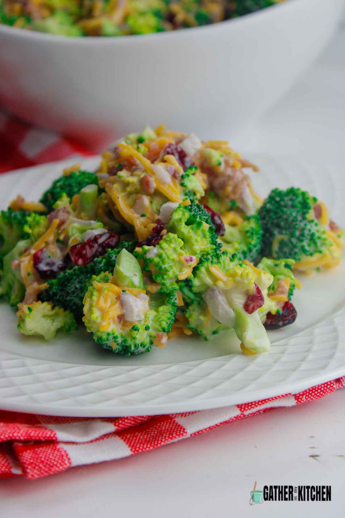Broccoli salad with bacon and cheese on a plate.