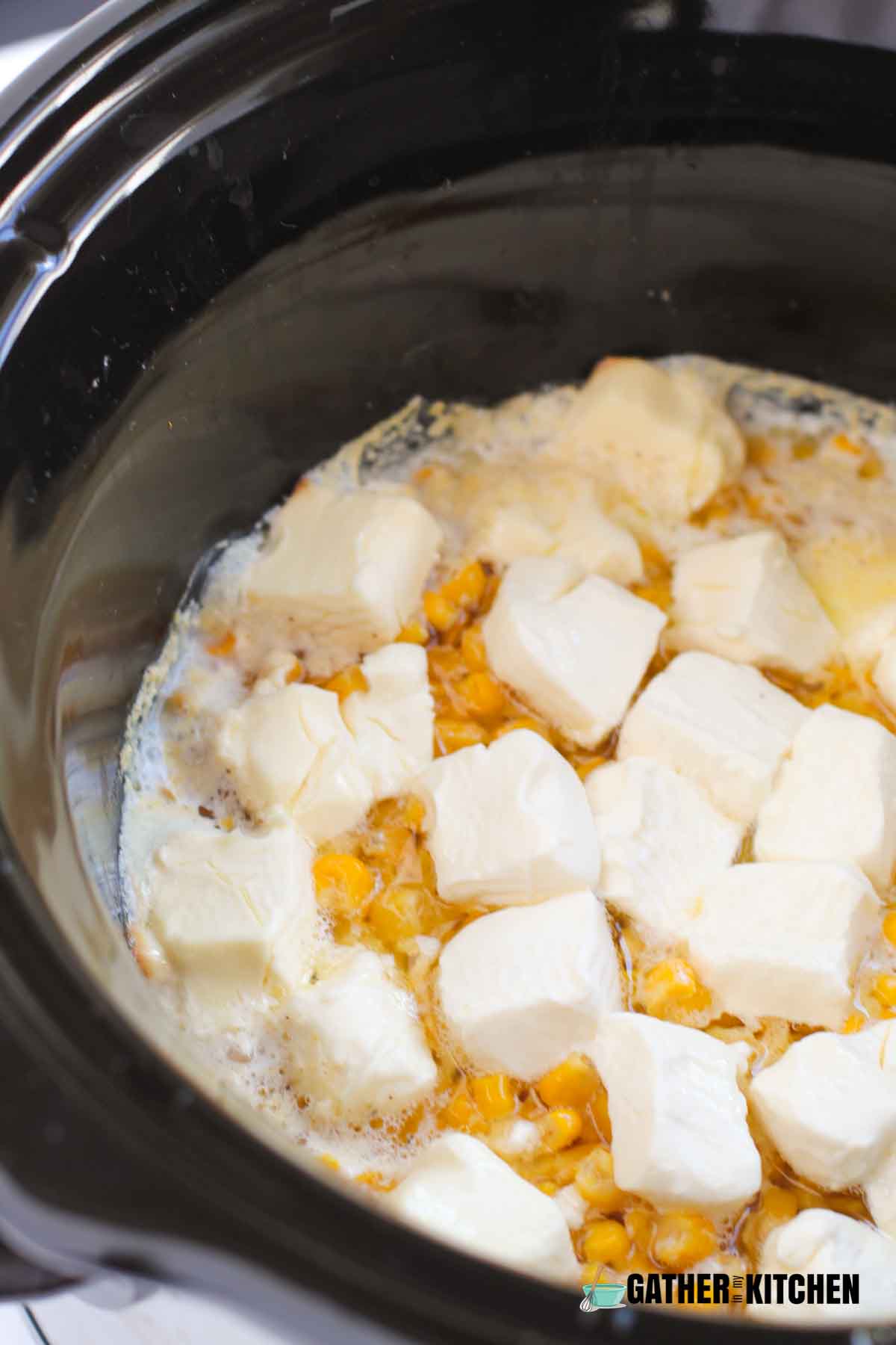 Corn cooked in the slow cooker, butter is melted and cream cheese is incredibly soft.