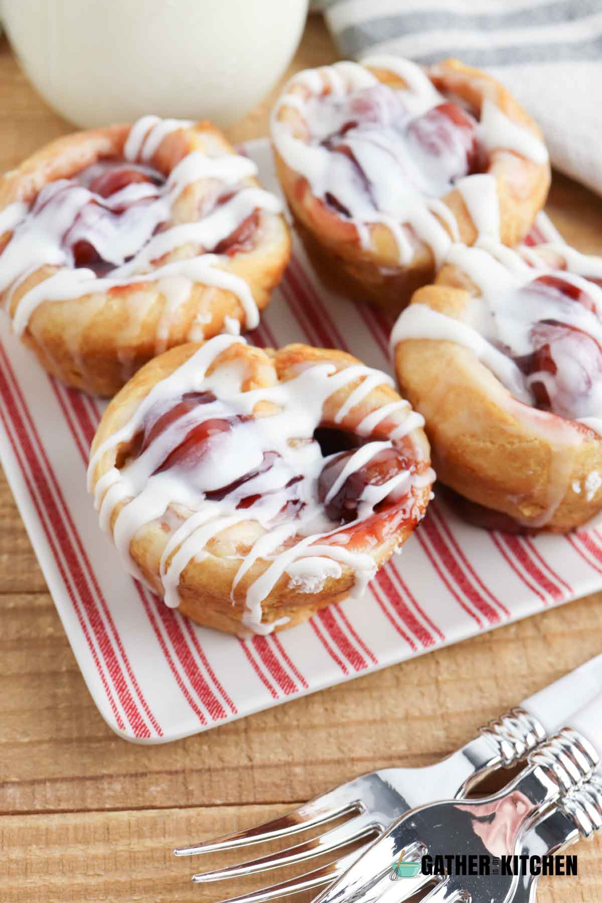 Cherry Danish muffins on a plate.
