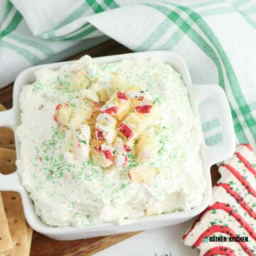Top down view of Christmas tree cake dip in a white square dish.
