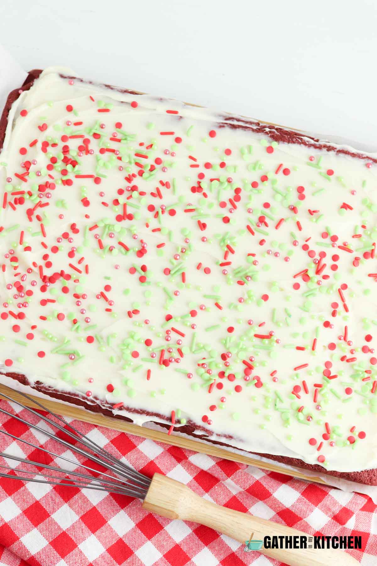 Cookie bars with frosting and sprinkles added.