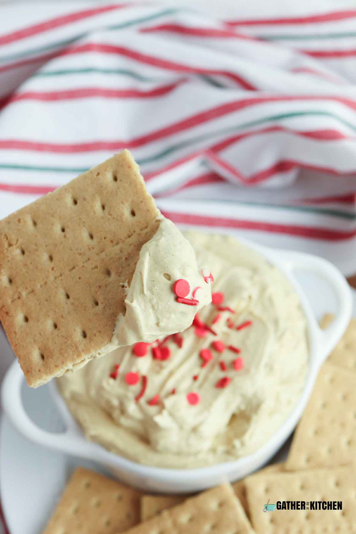 Graham cracker with gingerbread dip on it.