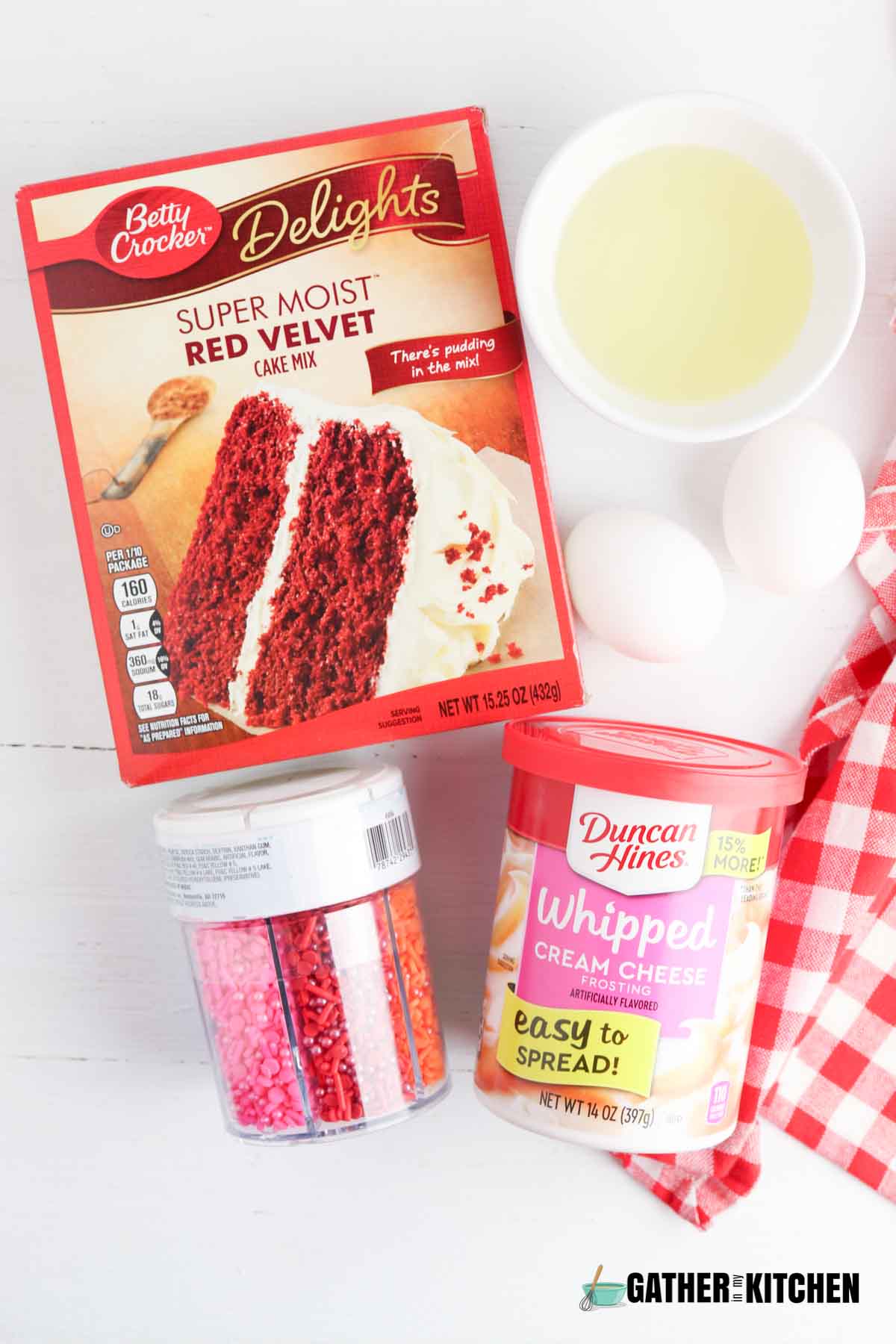 Ingredients for making red velvet cookie bars from cake mix.