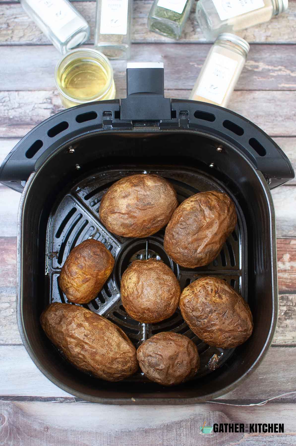 Cooked potatoes in air fryer basket.