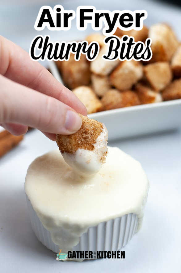Pin image: top says "Air Fryer Churro Bites" on top of a pic of someone dipping an air fryer churro bite into cream cheese dip.