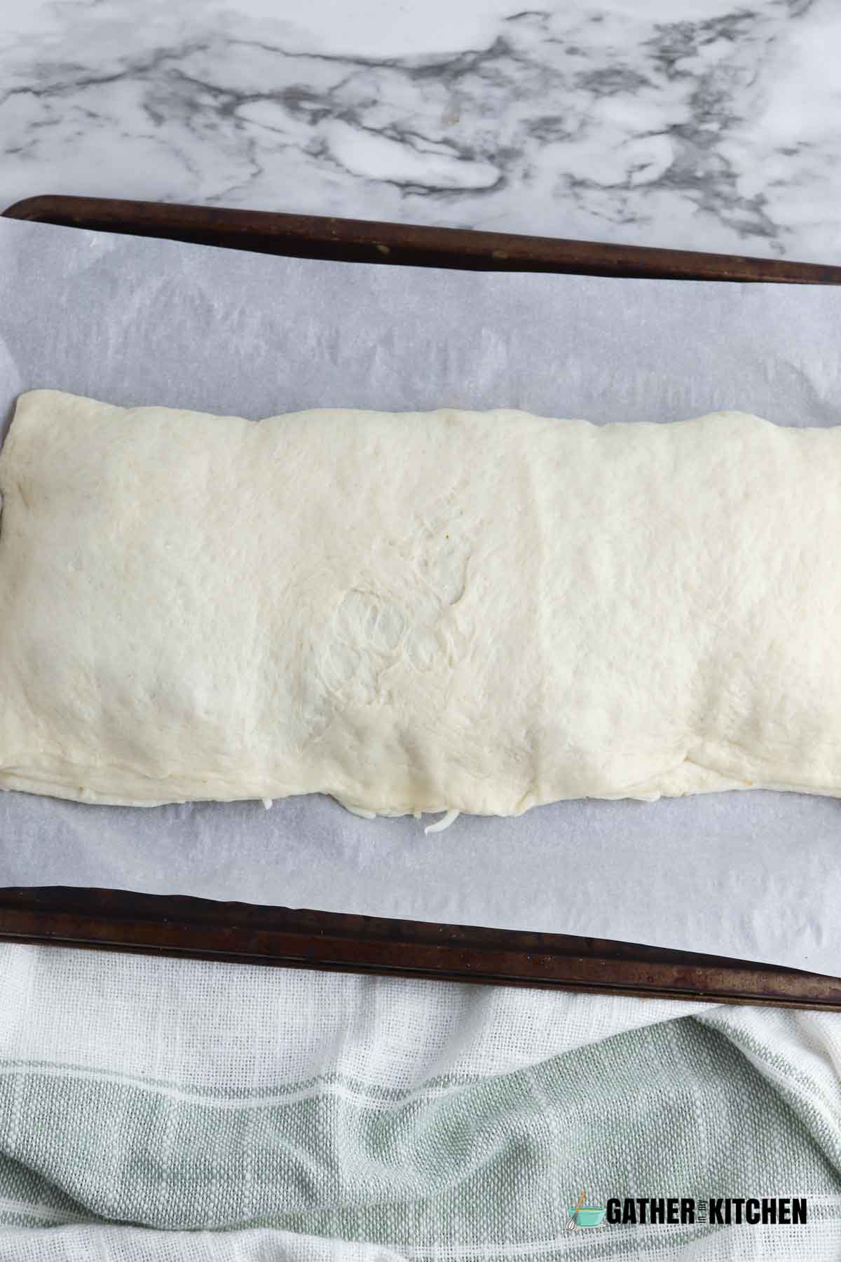 Dough folded over and sealed.