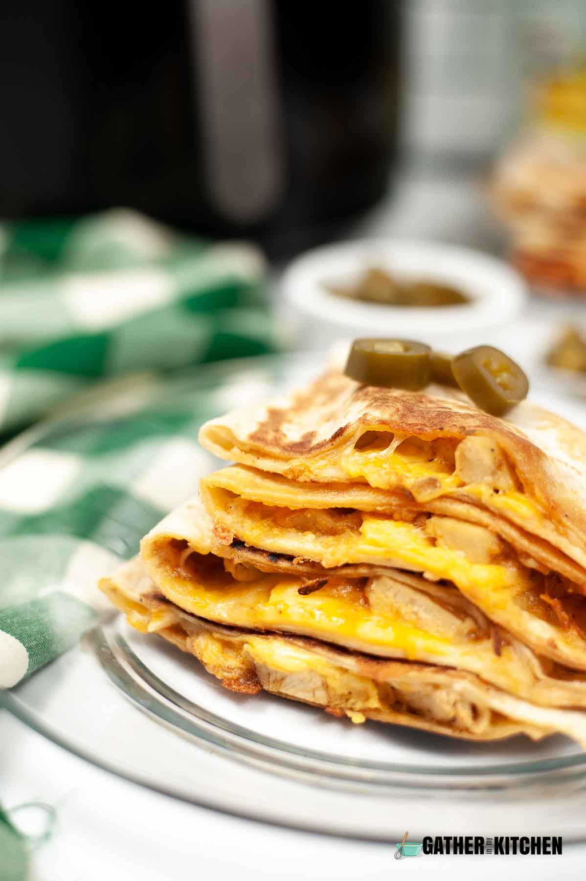 Stack of copycat Taco Bell quesadillas on a plate.