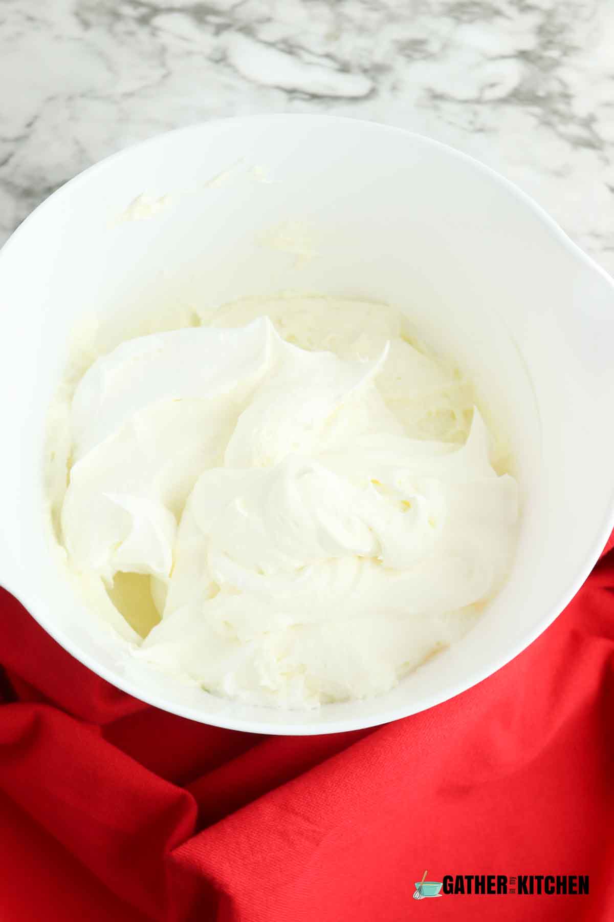 cream cheese and sugar mixed with the whipped cream on top.