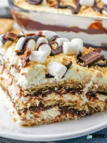 Side view of a piece of s'mores ice box cake on a plate.