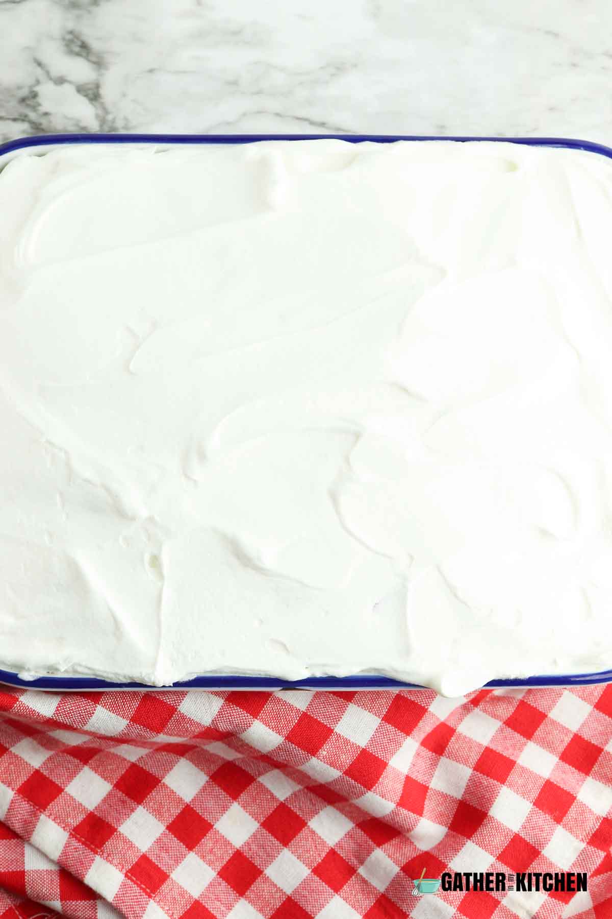 Whipped topping on top of berry layer.
