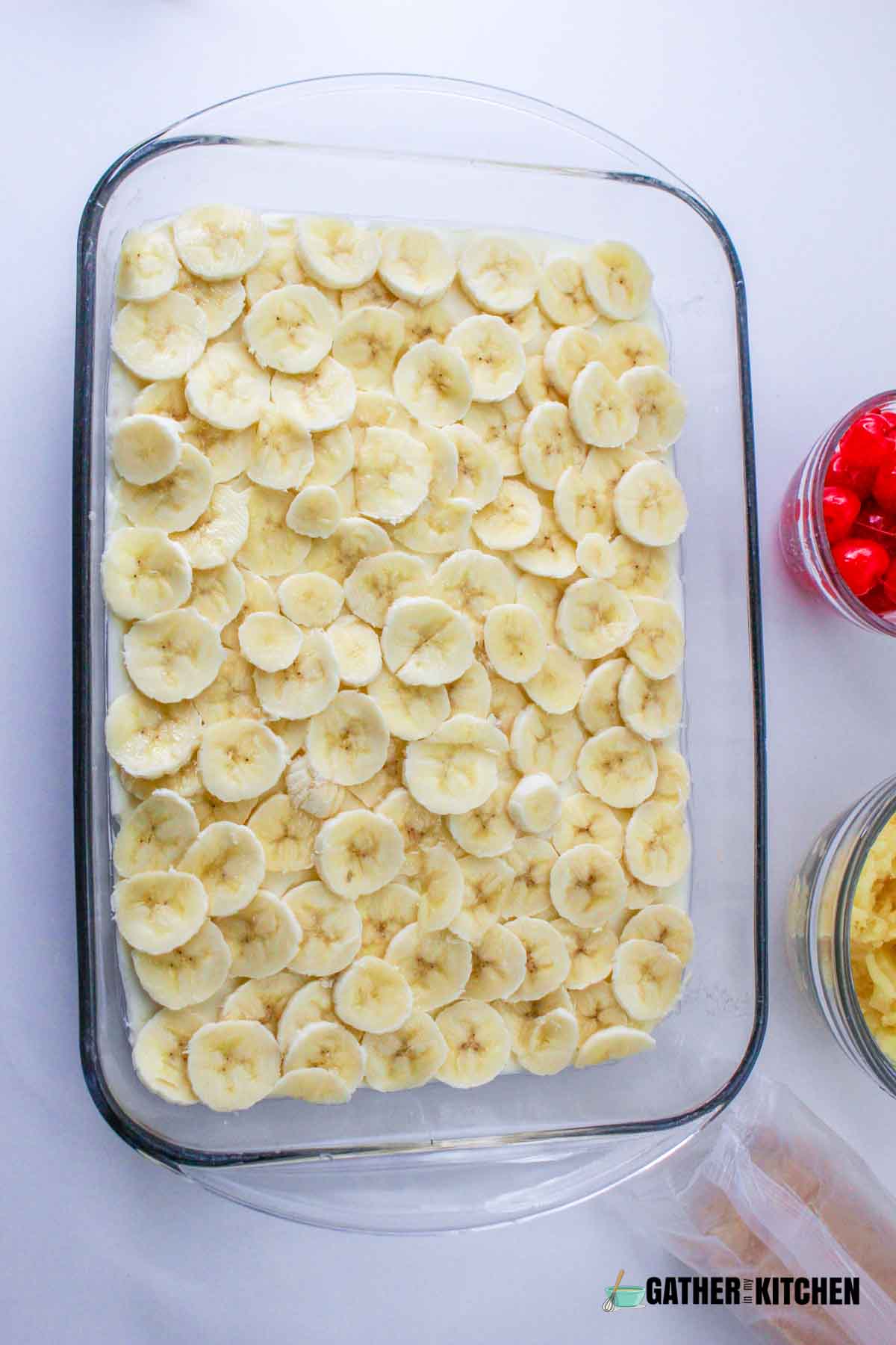 Sliced bananas over the cream cheese layer.