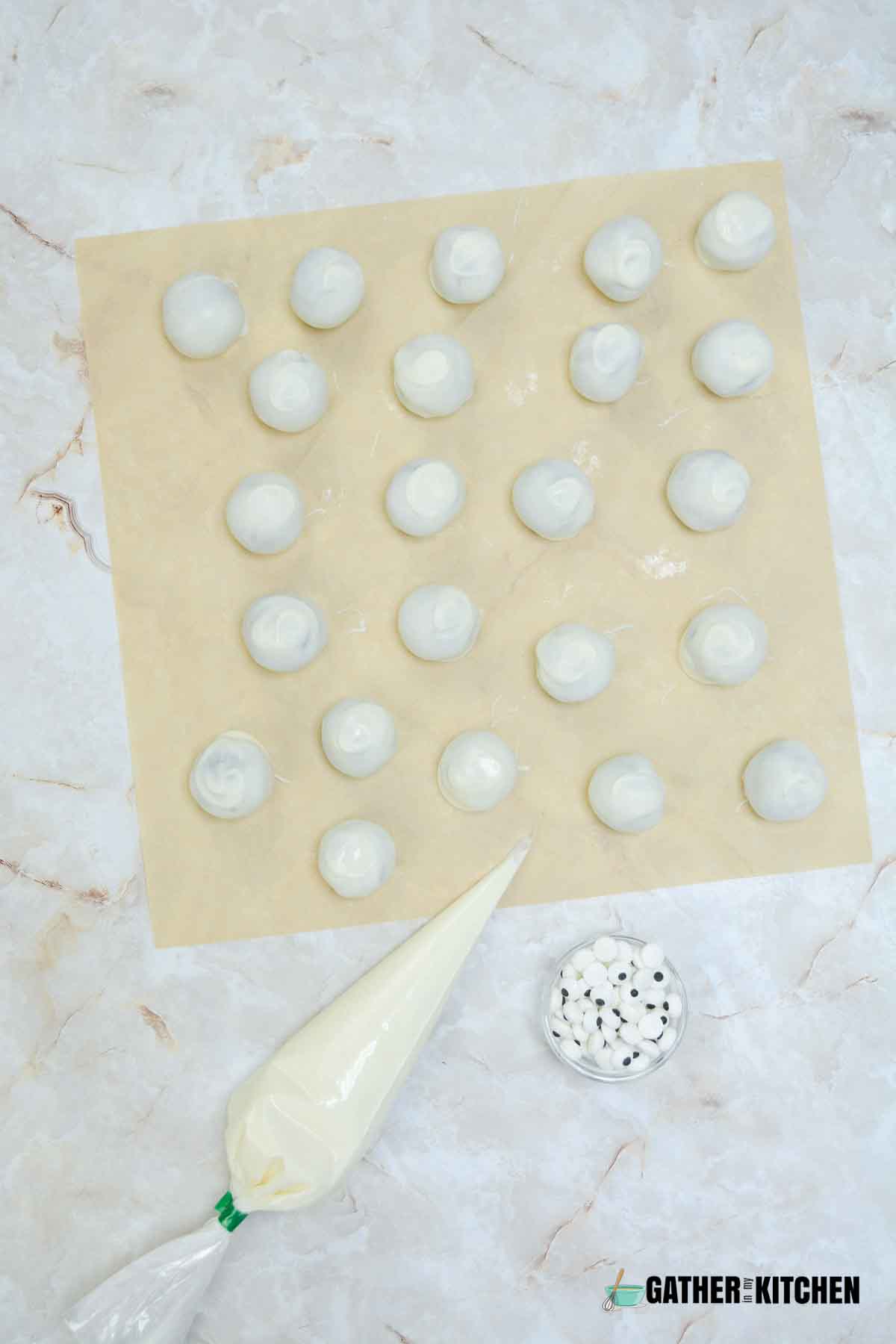 Oreo balls covered in white chocolate.