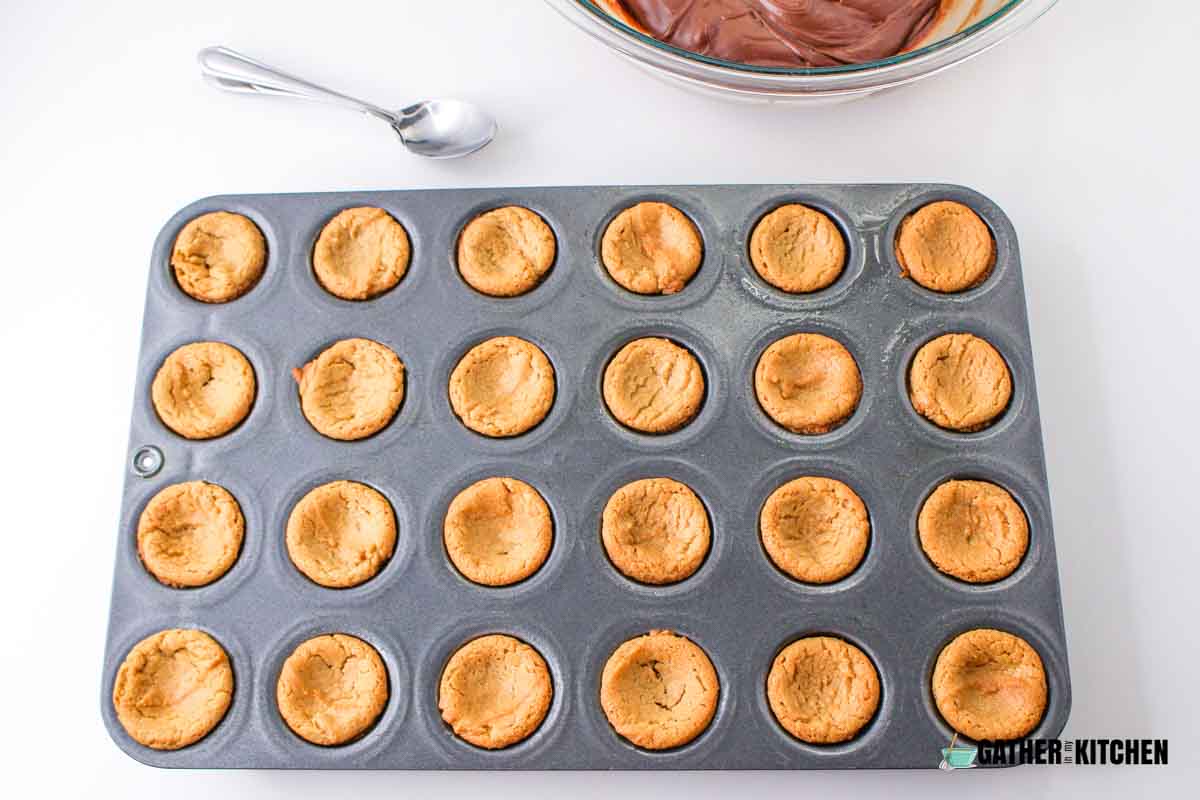 A baking sheet with golden brown cookies.