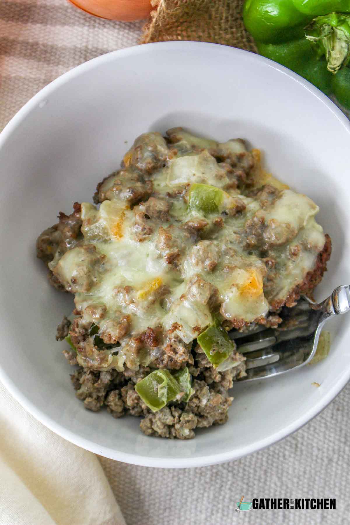 A bowl of philly cheesesteak casserole.