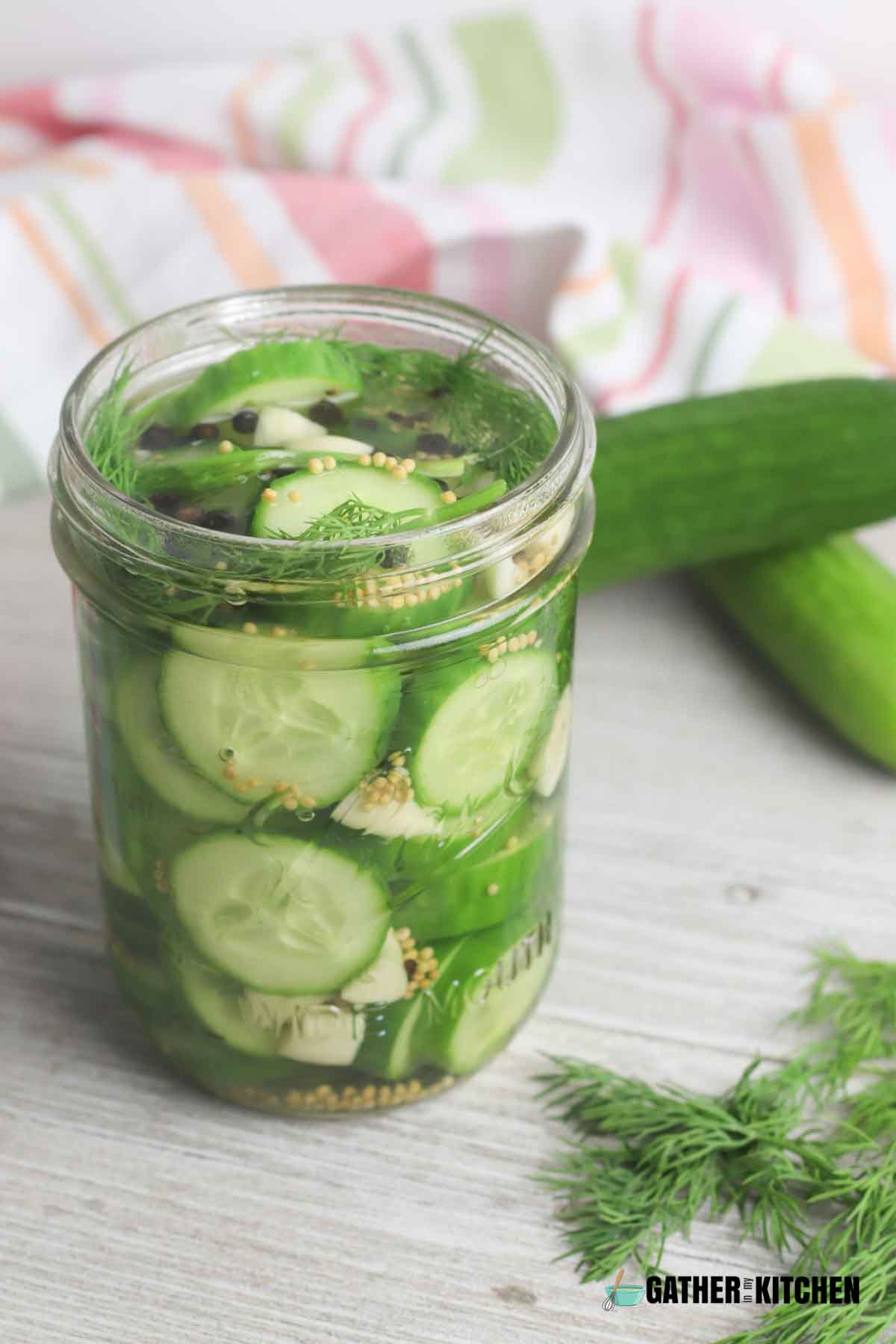A closeup of a jar of refrigerator pickles.
