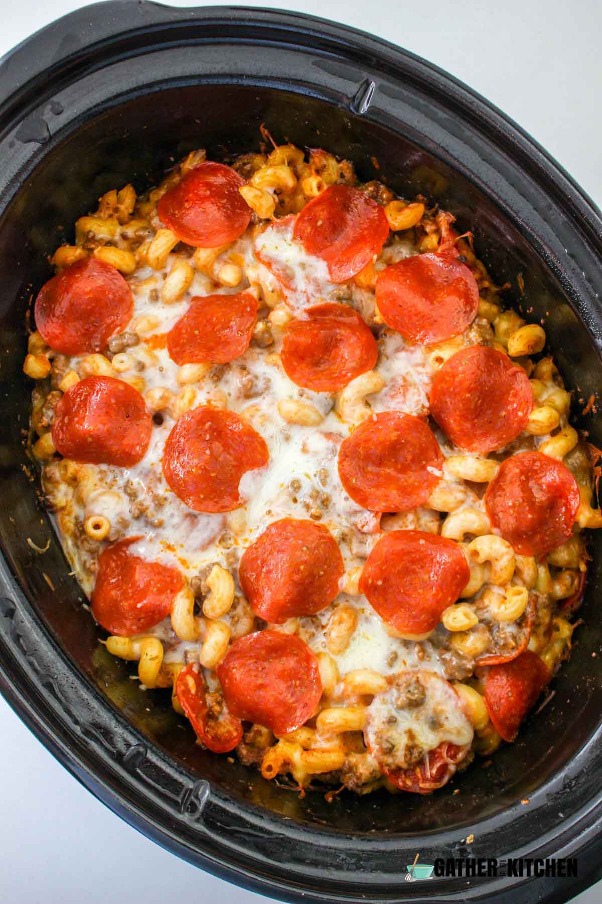 Freshly cooked pizza casserole in a slow cooker.