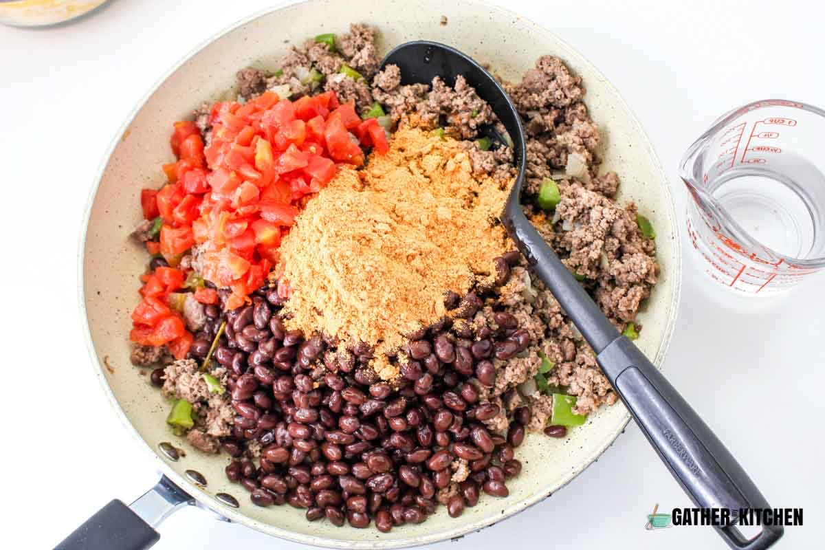 Ground beef with seasonings, black beans and tomatoes.