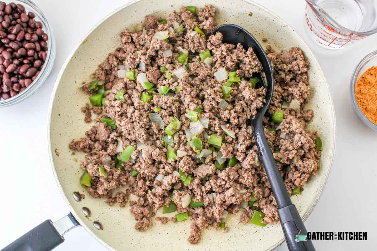 Cooked ground beef with onions and bell peppers.