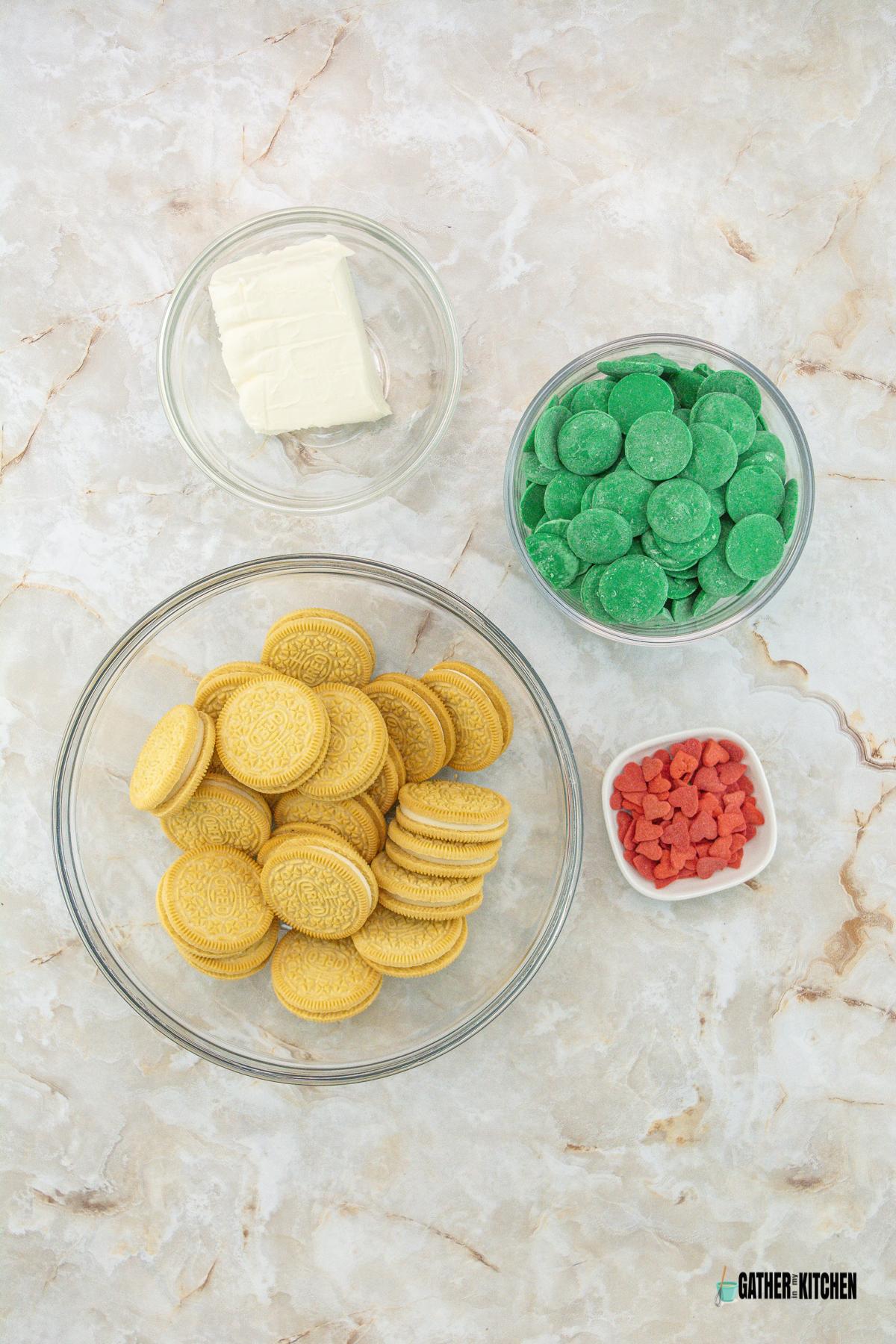 Ingredients: golden Oreos, cream cheese, sprinkles, and green candy melts.