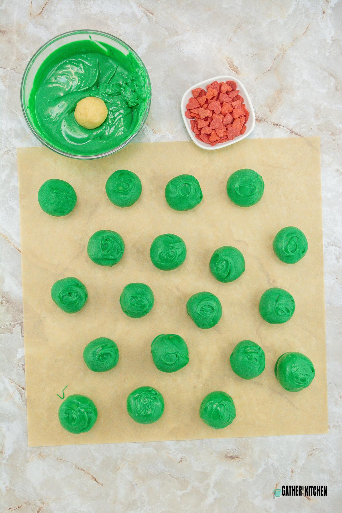 Oreo balls covered with green candy melts.