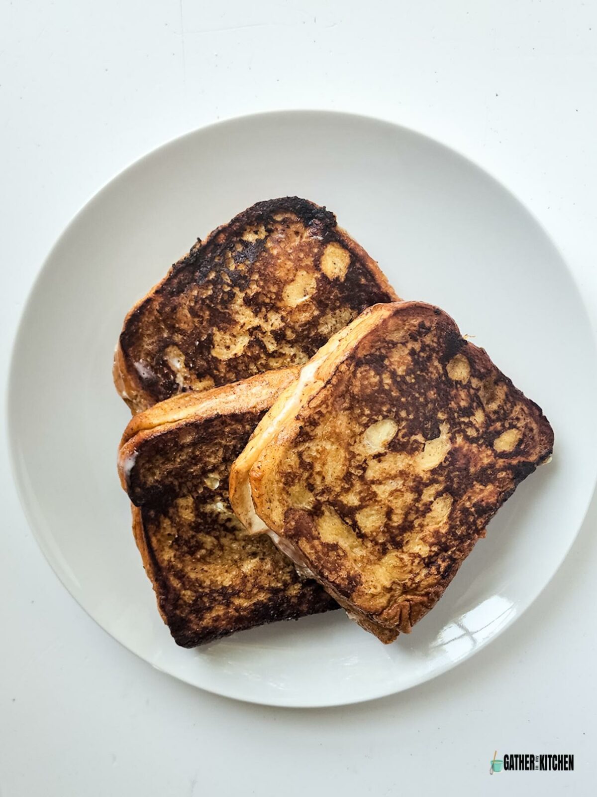 Pieces of french toast on a plate.