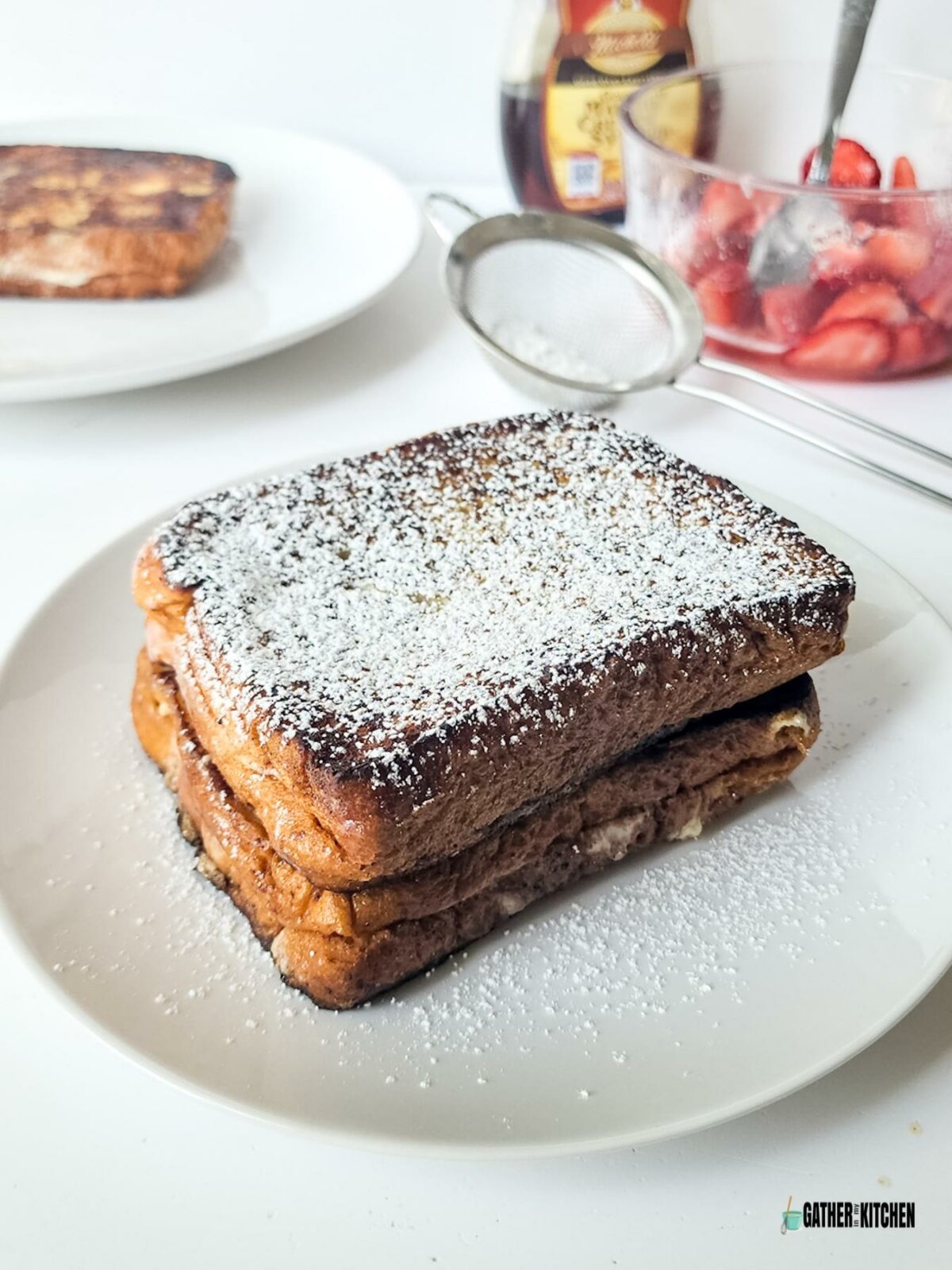 French toast with powdered sugar on top.