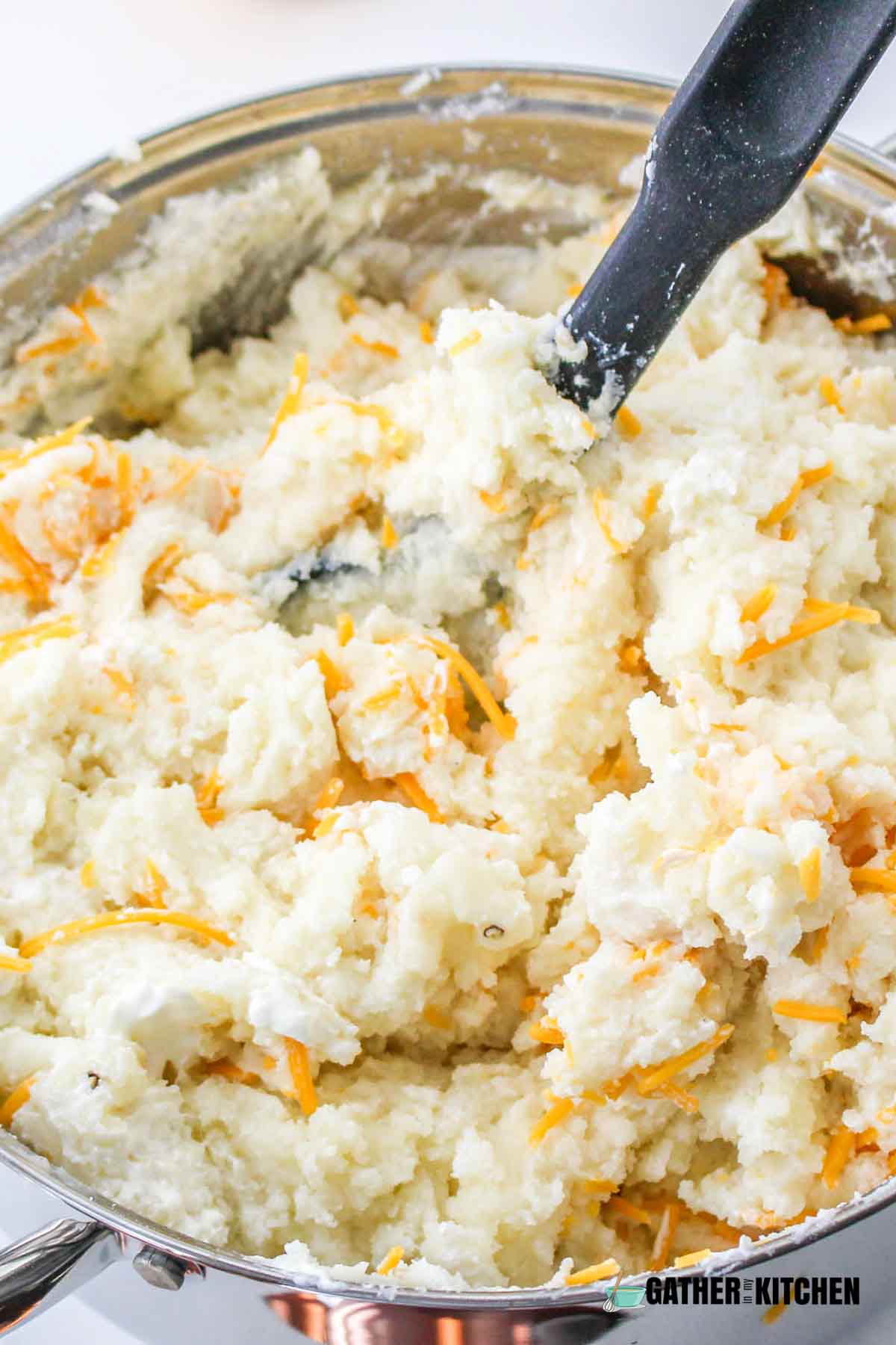 Cheddar cheese mixed with mashed potatoes.