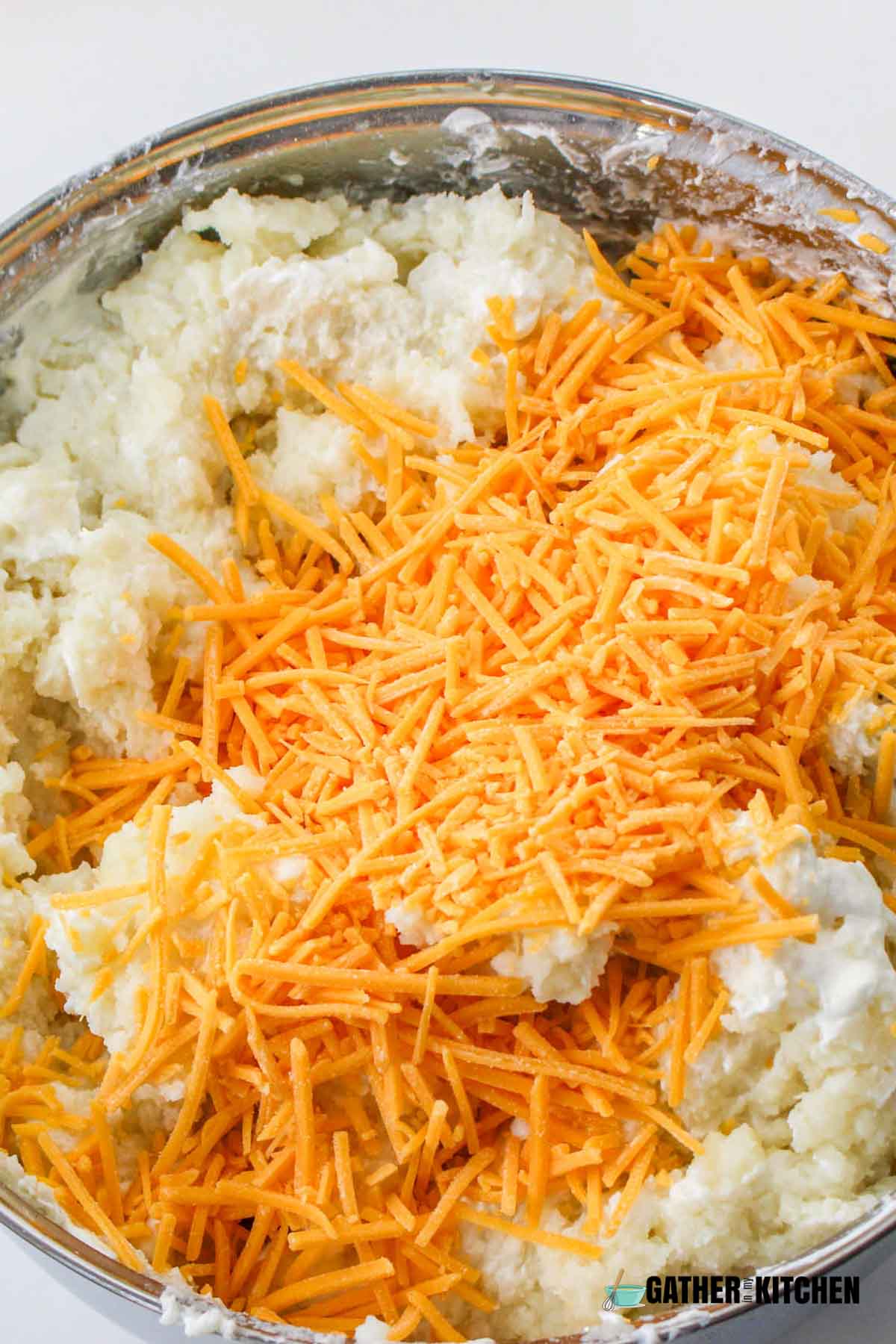 Cheddar cheese added to mashed potatoes.