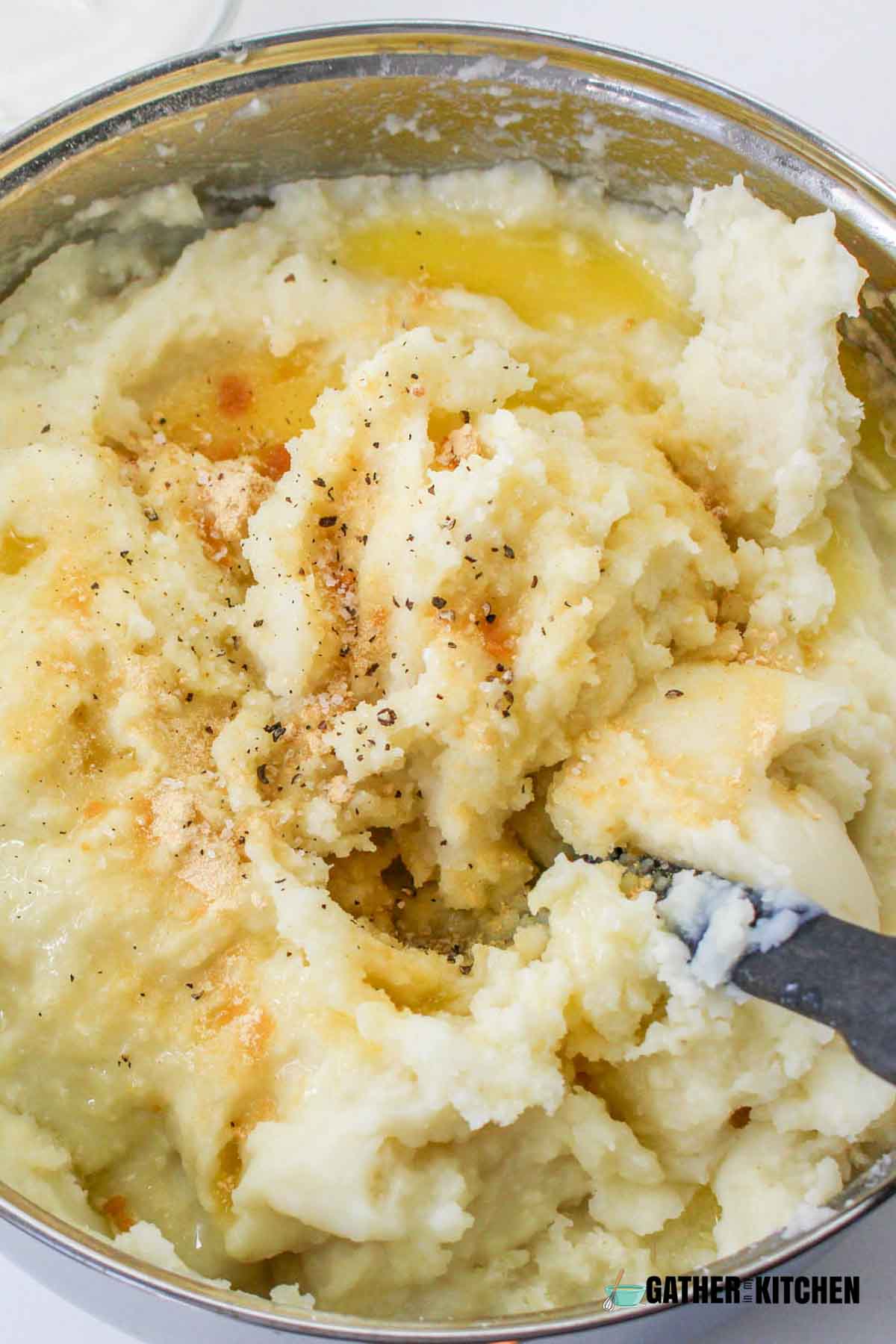 Mashed potatoes with melted butter, salt and pepper.