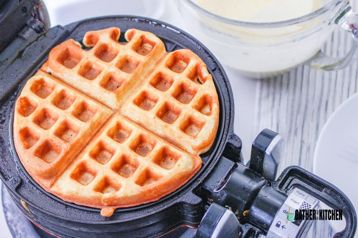 Cooked waffle in waffle maker.