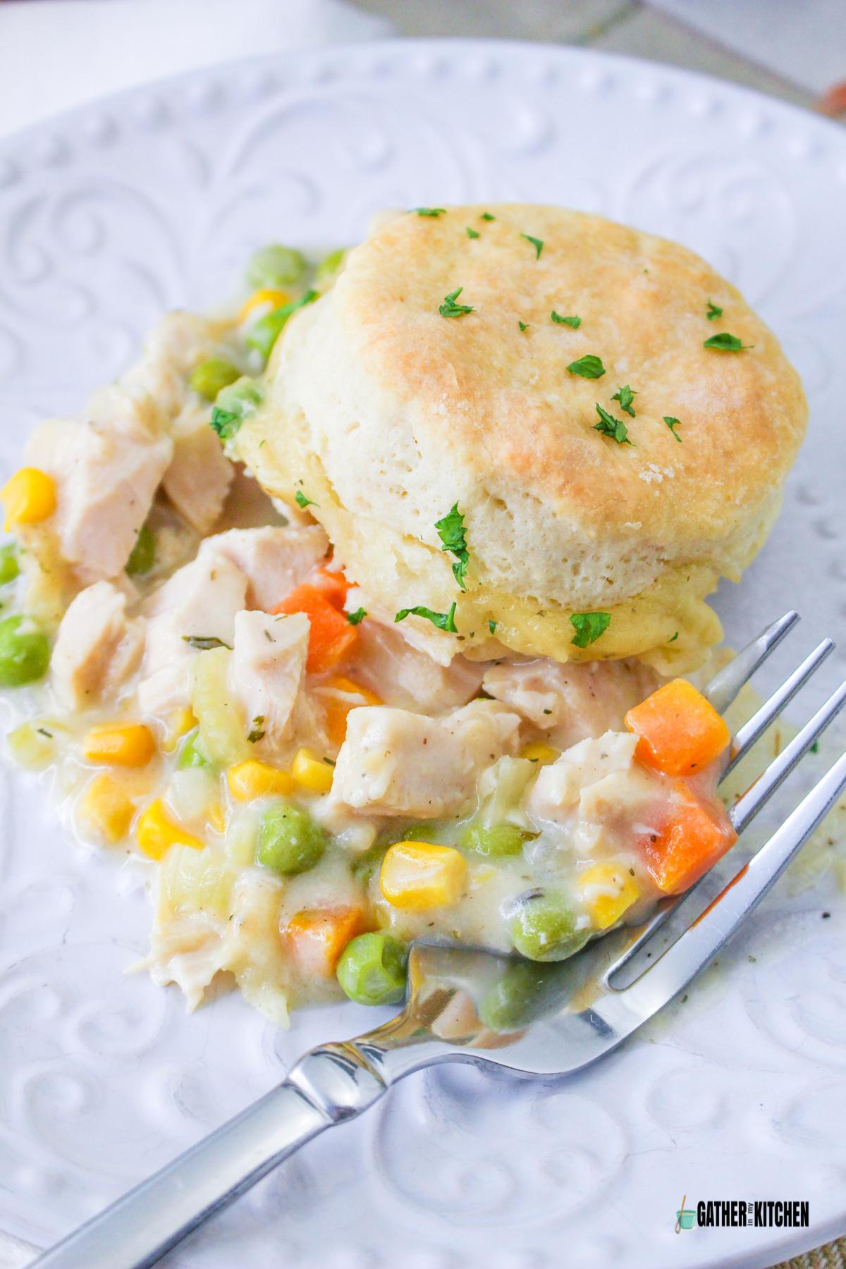 Turkey Pot Pie with biscuits on a plate.