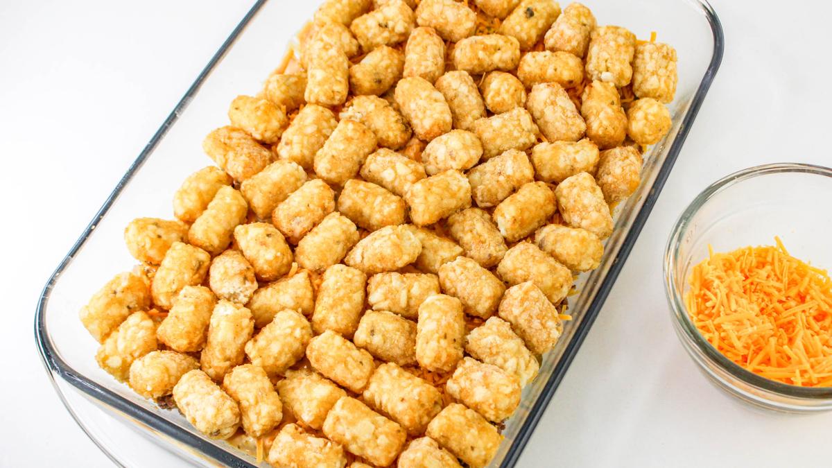 Tater tots in the casserole dish.